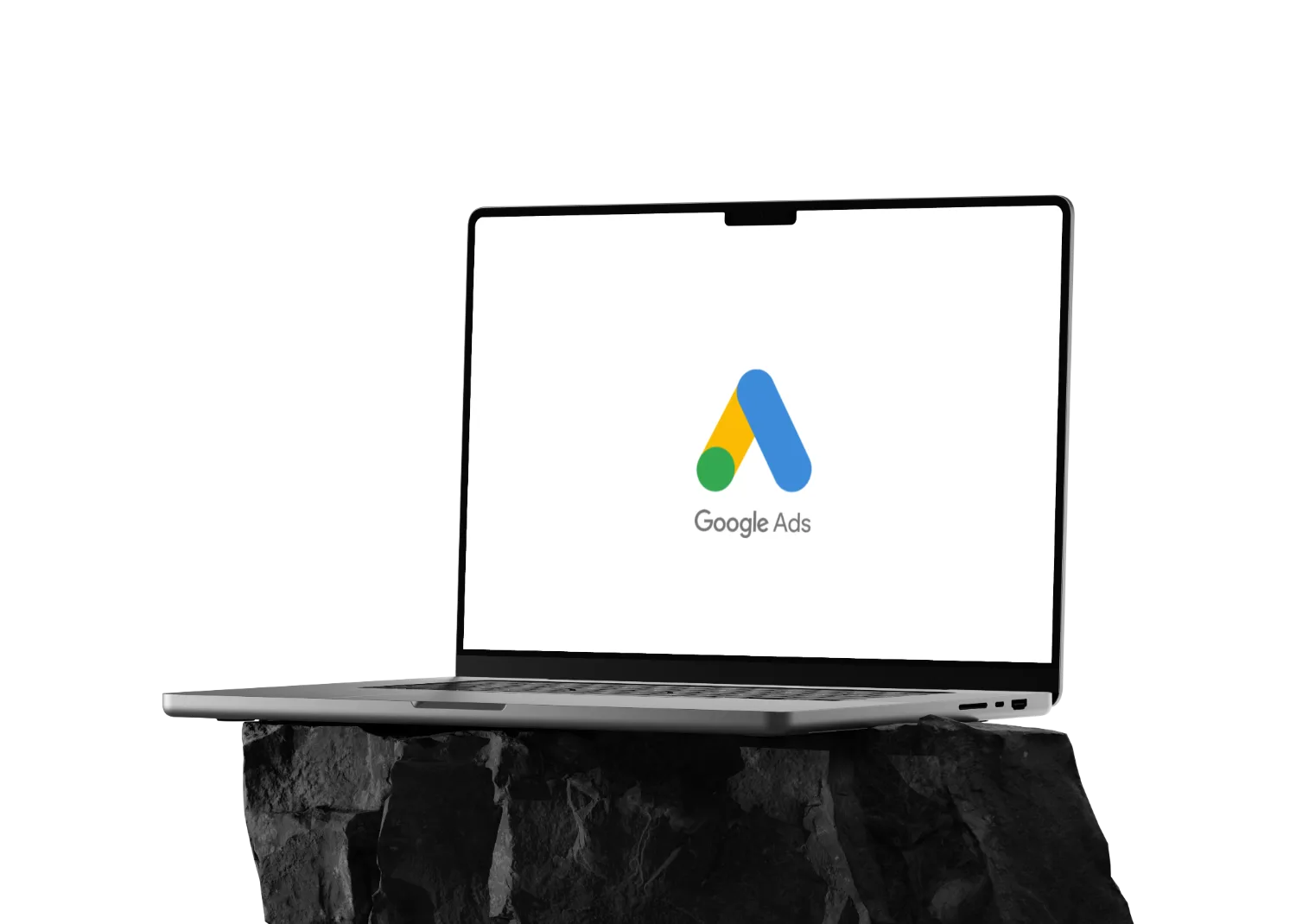 Image of a macbook on a rock with the Google Ads (PPC) logo on it